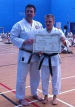 Karate Sensei been awarded his Black Belt first dan shodan at grading.